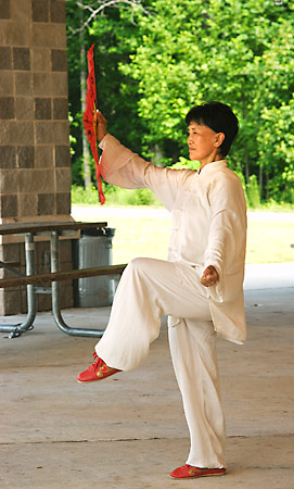 Grand Master YunXiu Yang  practicing Tai Chi Fan