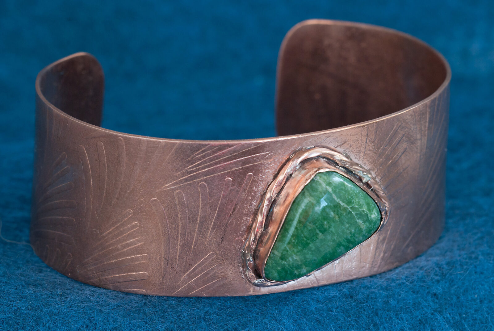 Copper cuff bracelet with green stone