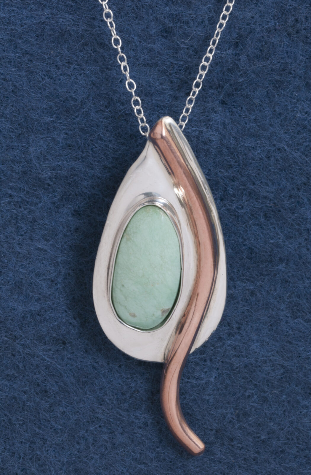 Silver pendant with mint green stone, copper accent